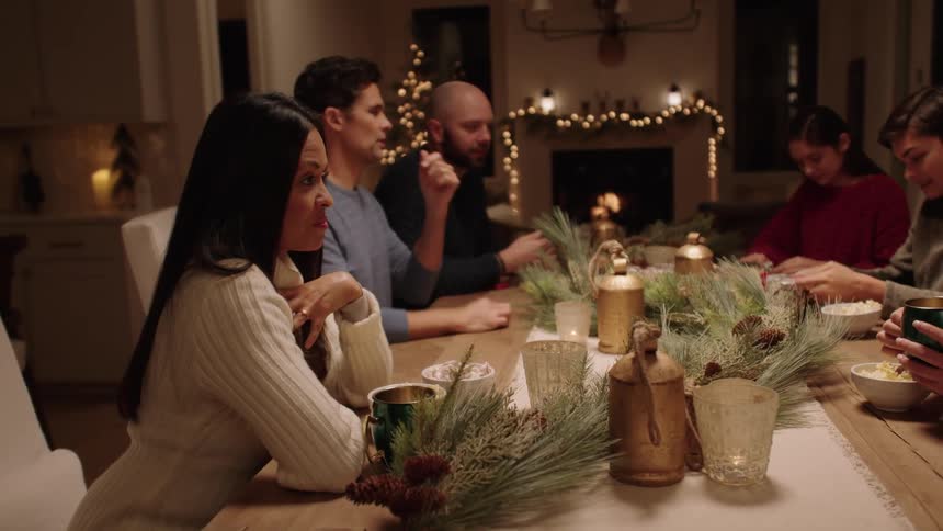 A family talk and wrap gifts at the table