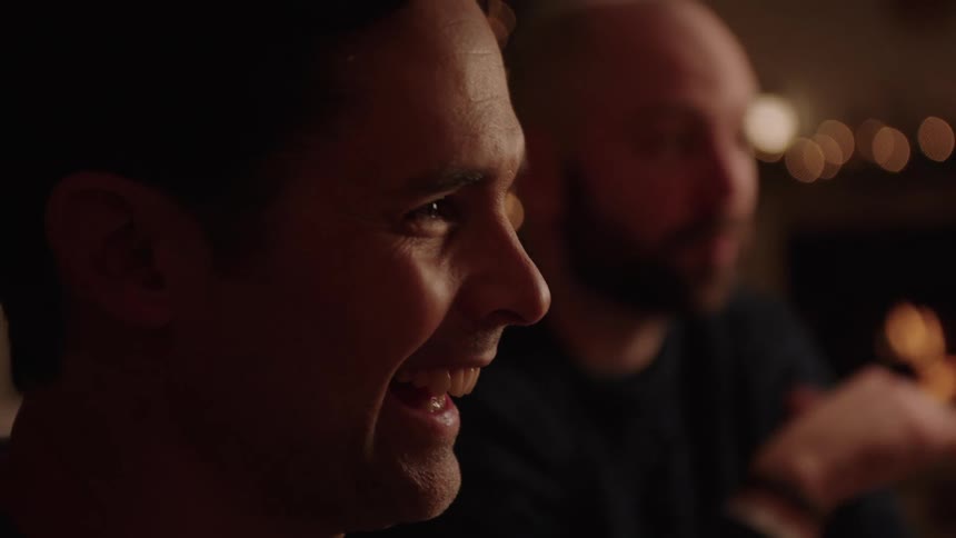 Portrait of two smiling men talking