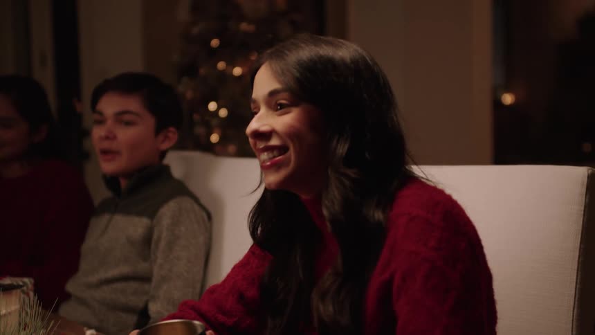 Friends talking and sitting at the table at a family gathering