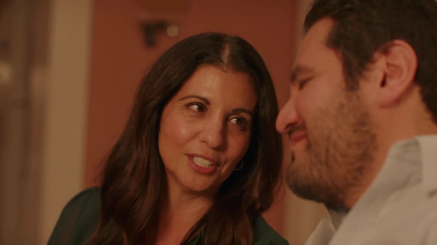 A couple looking at each other passionately while talking