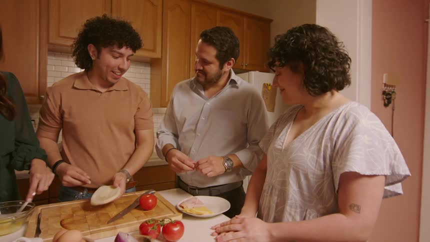 A family cook together in the kitchen