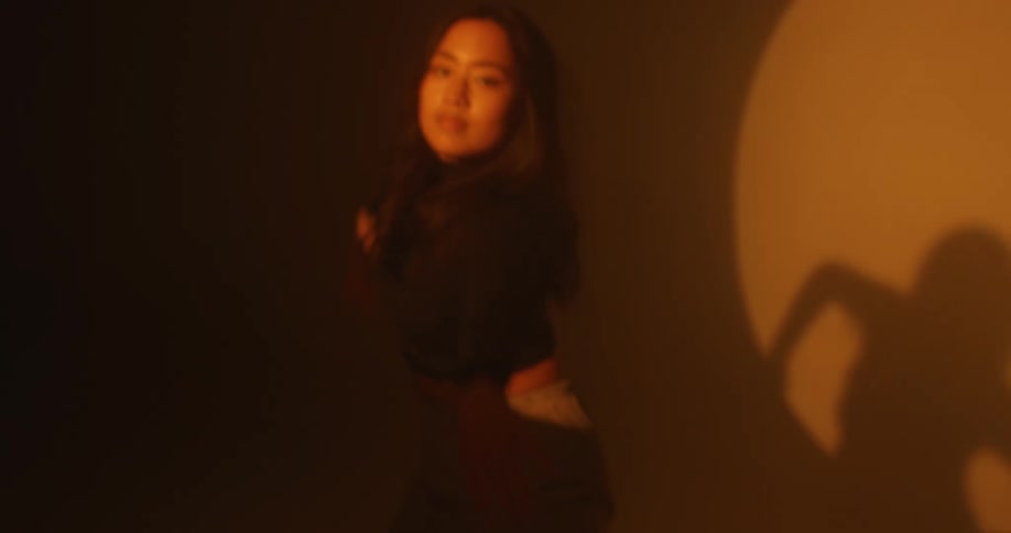 Lady dancing in a yellow room