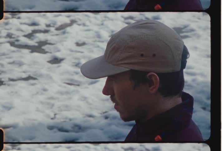 A man is looking forward by the snow