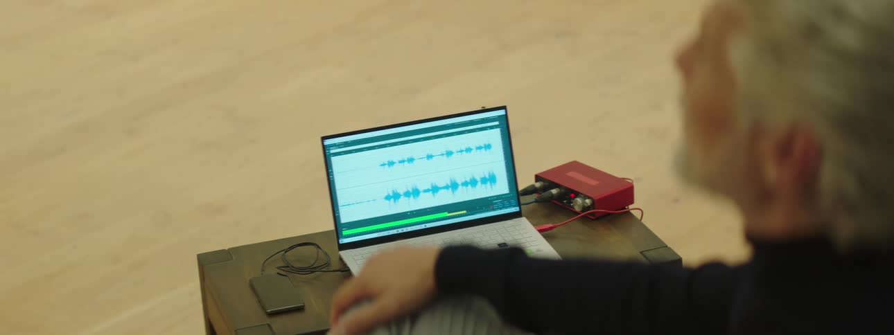 A man using a laptop in a room