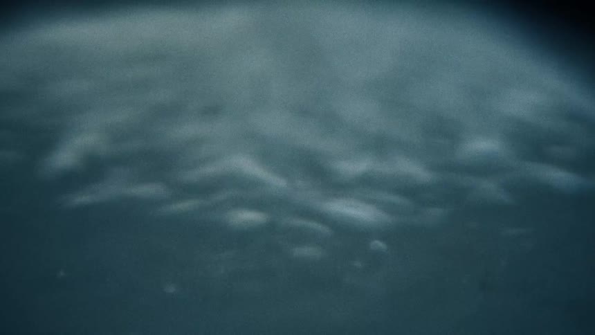 Close up of the ripples on the surface of a liquid