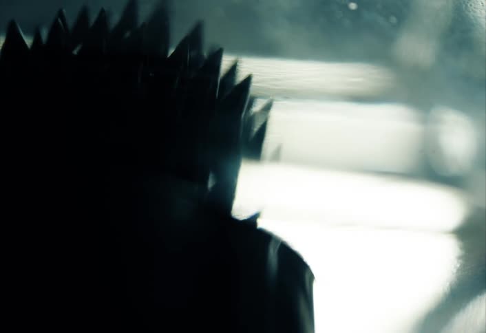 Spikes of dark ferro fluid moving under magnetic fields