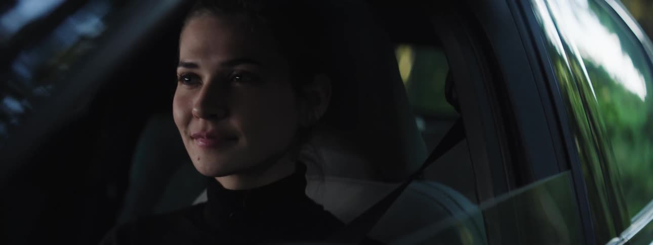 Portrait of a young woman driving