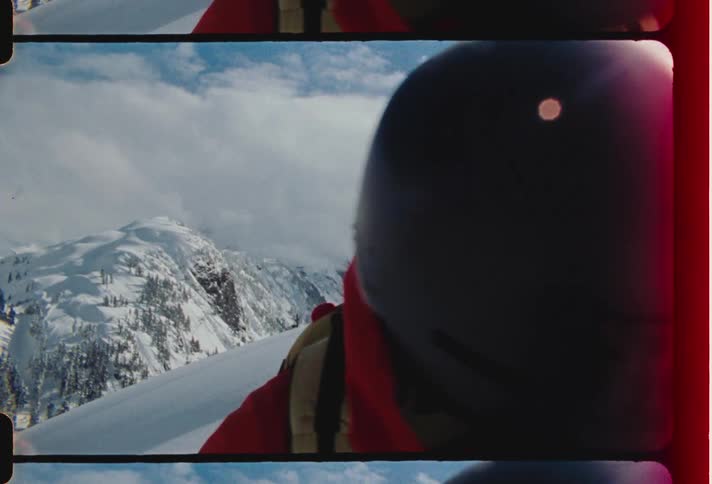 Closeup of a person wearing a mask helmet on a snowy mountain