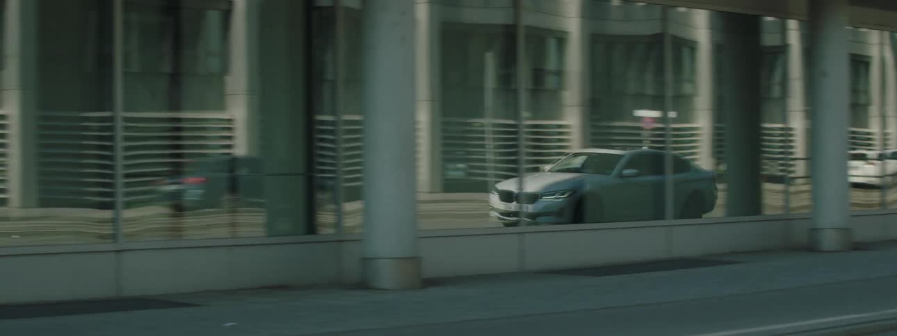 Motor vehicle moving on a city road during the day