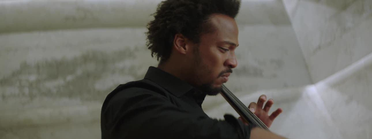 A man playing the cello
