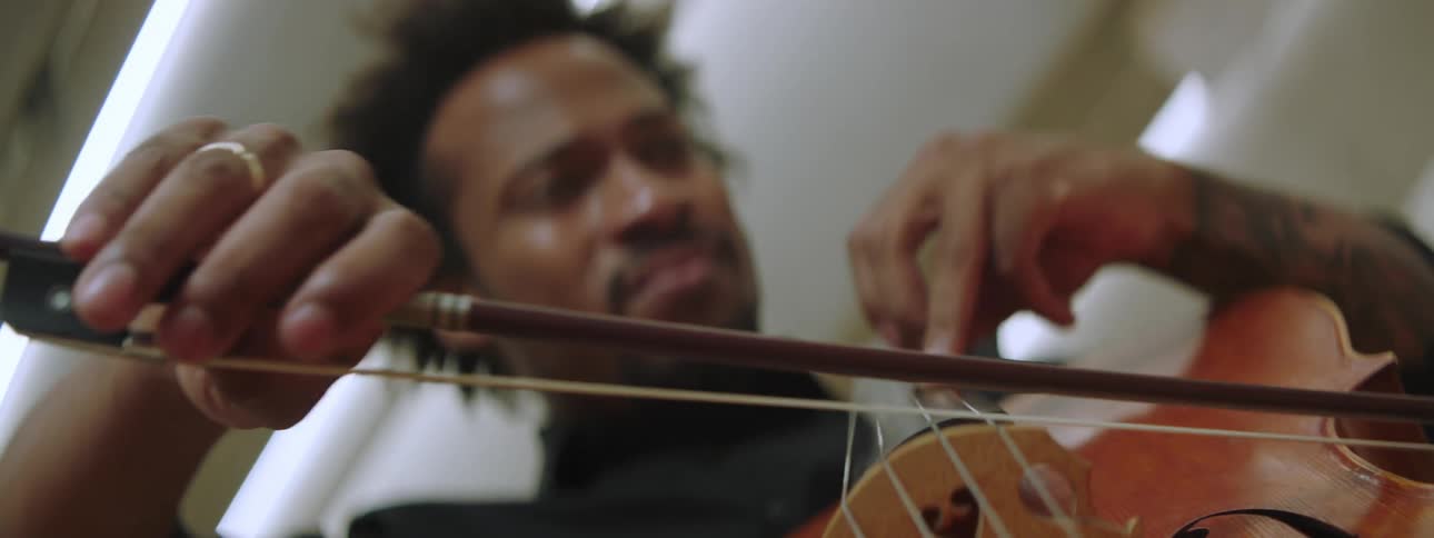 A man playing cello