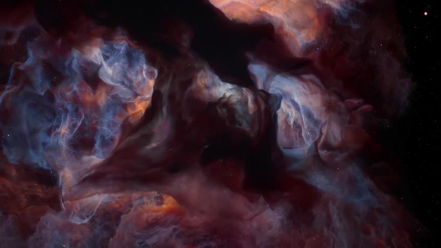 Colorful clouds illuminated by a distant sun move among the stars in outer space