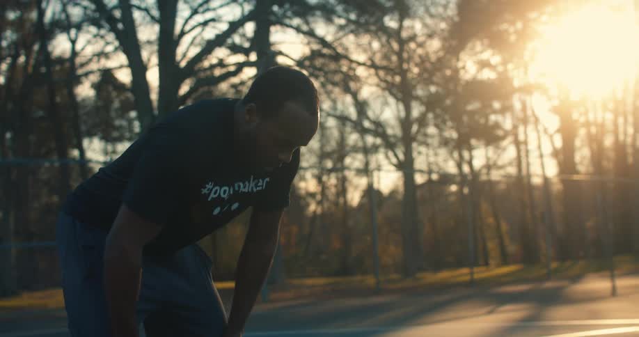 A man shoots the basketball on the court