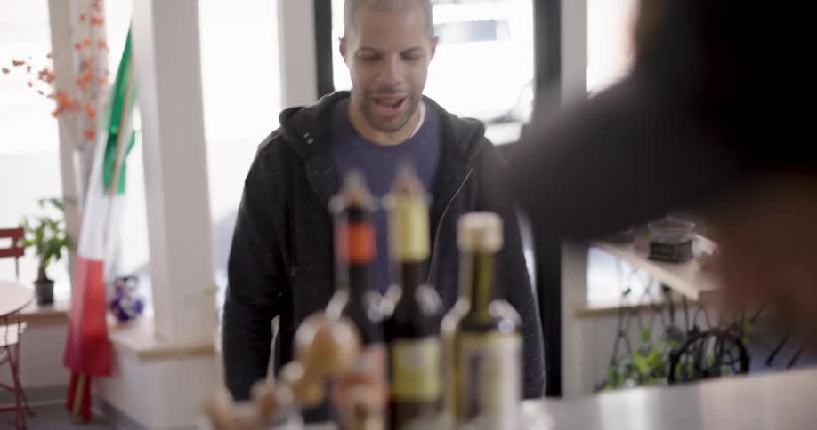 Man inside an establishment placing an order