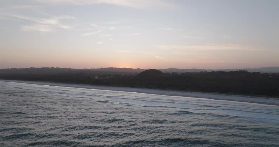 Aerial of a deserted beach at sunset