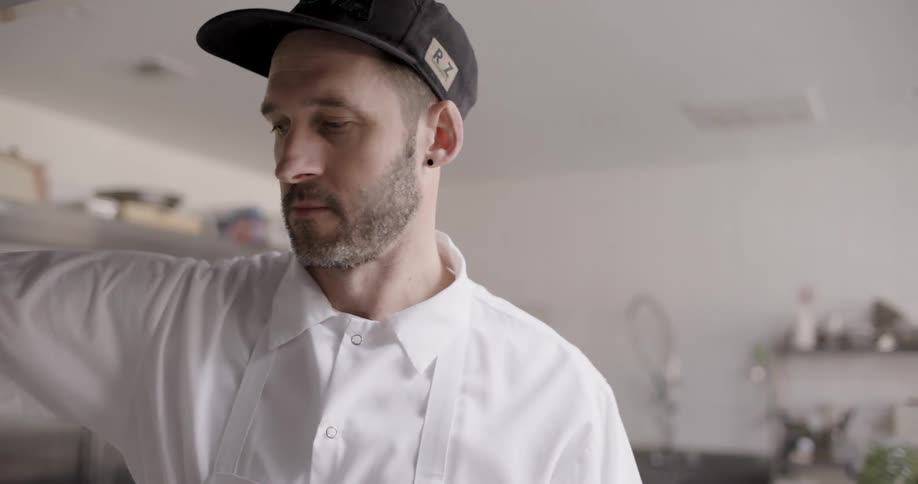 A man in the kitchen preparing a meal