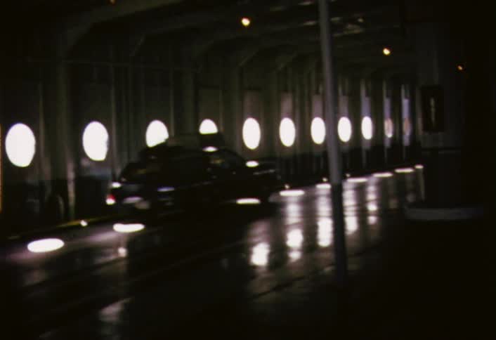 Cars driving through a dimly lit tunnel