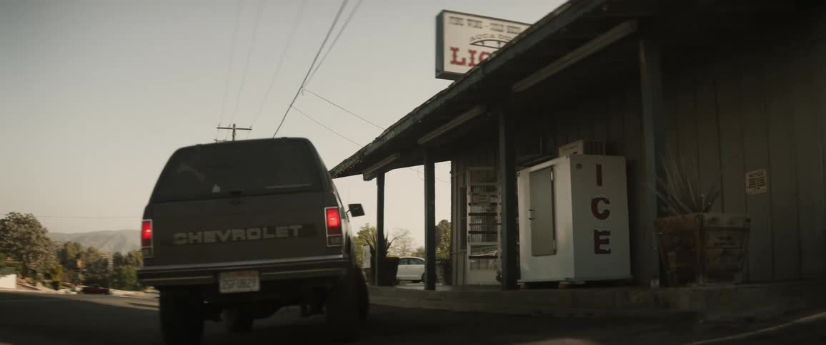 Pickup truck parking next to a business
