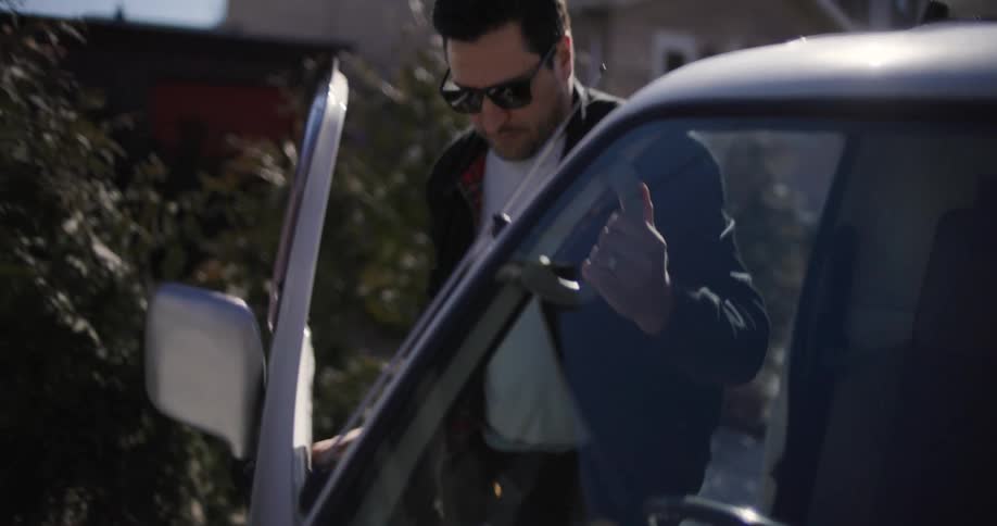 Man getting out of his vehicle and closing the door