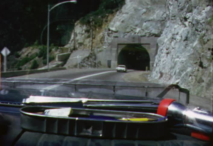 Cars driving into a tunnel