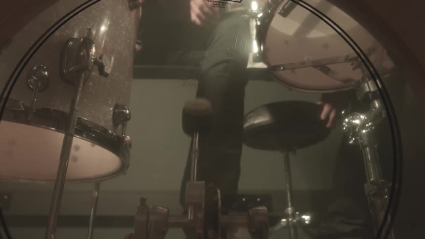 Inside the largest drum in a drum kit as its hit with the drum pedal