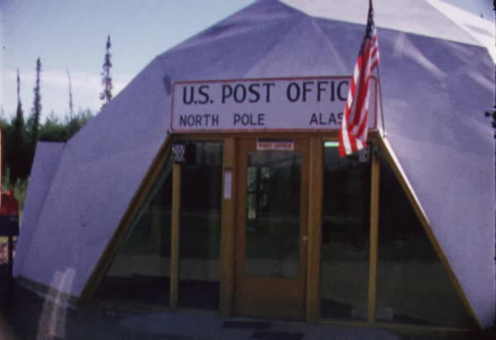 The post office is small with a white tarp over the top