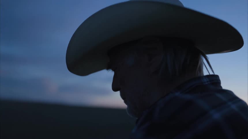 A man is watching the sunset