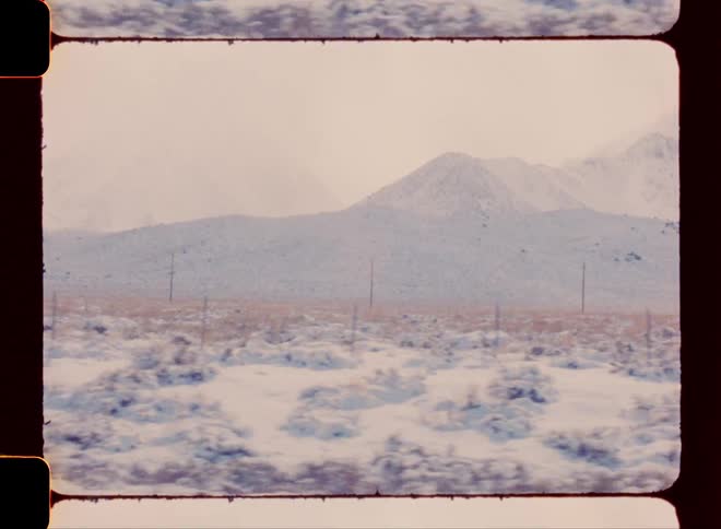 Snow covered soil and mountains
