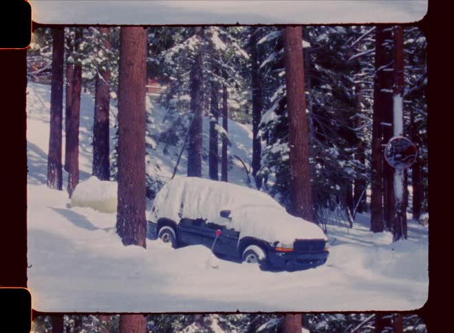 Pickup truck in a forest stopped by snow