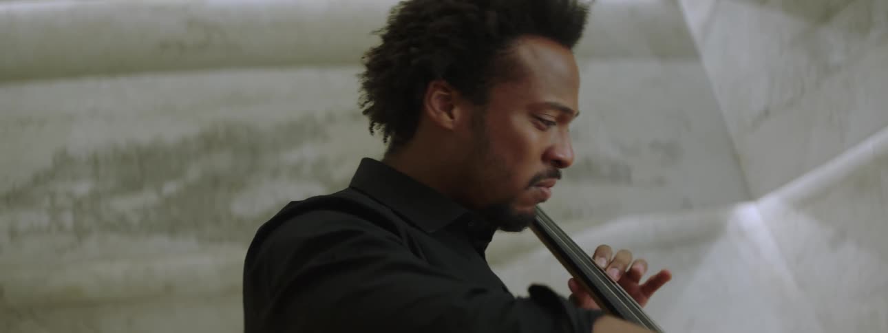Man sitting playing violin