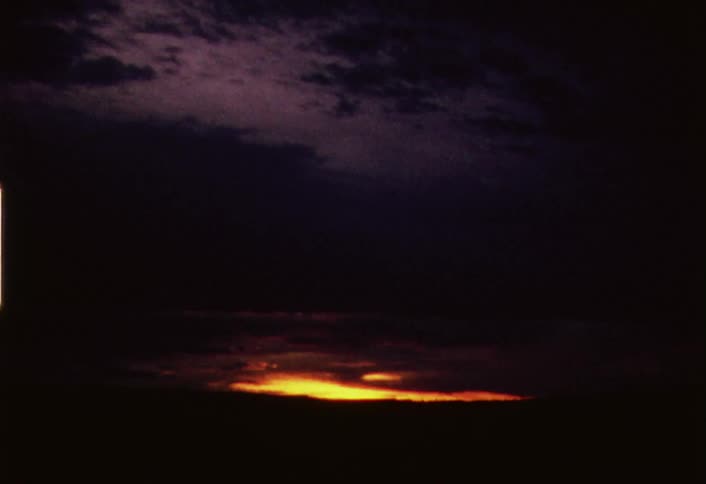 View zooming in on a cloudy sunset