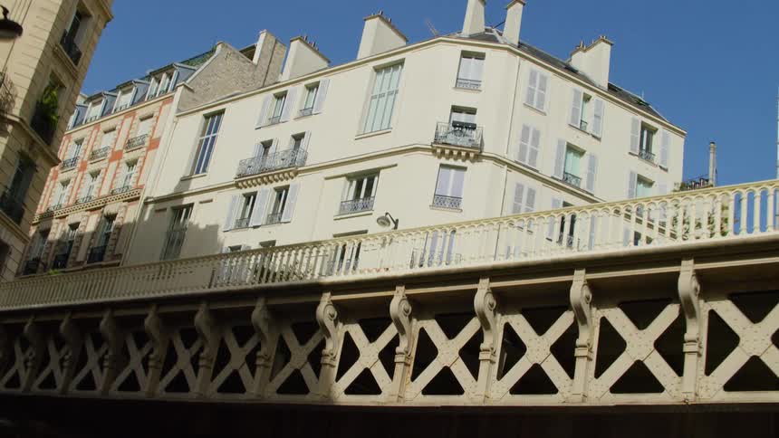 A bridge connecting large buildings in a city
