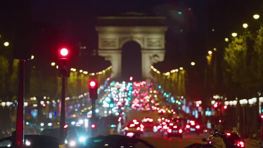 Heavy traffic on the road leading to the arc de triomphe in paris