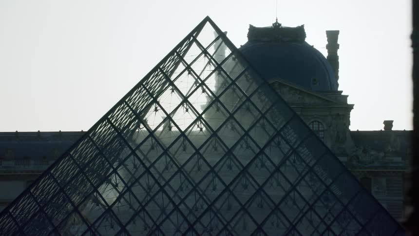 A triangle of windows is in front of the mansion