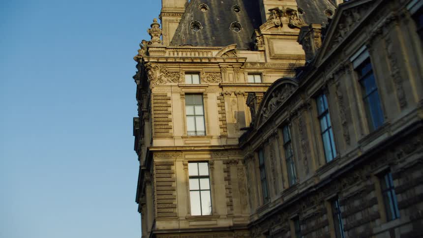 Gothic and ancient architecture of a building on a cloudless blue sky day