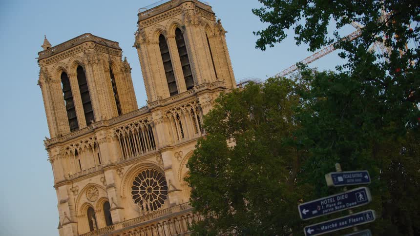 Facade of a cathedral with trees around it in the city