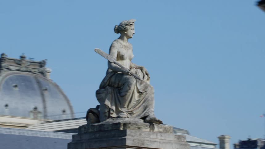 Pillar in monument with a woman in the middle of the city
