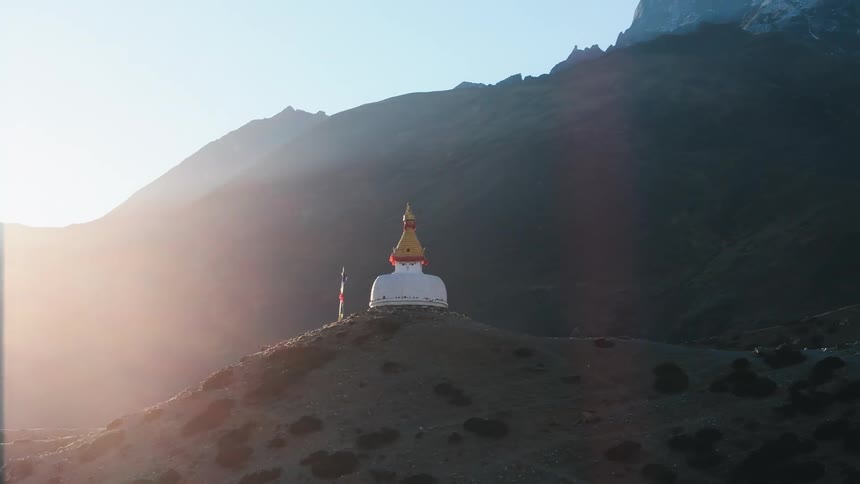 Sanctuary on a rocky mountain with solar flare
