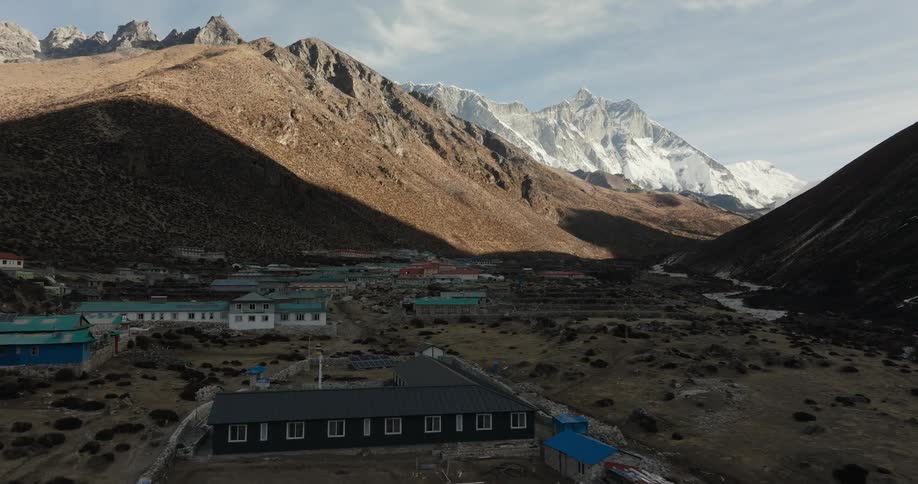 Village on a plateau in the middle of mountains in winter