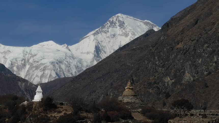 Two religious structures in a mountainous area