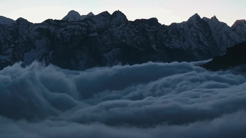 Mountains above cloud level on a winter morning