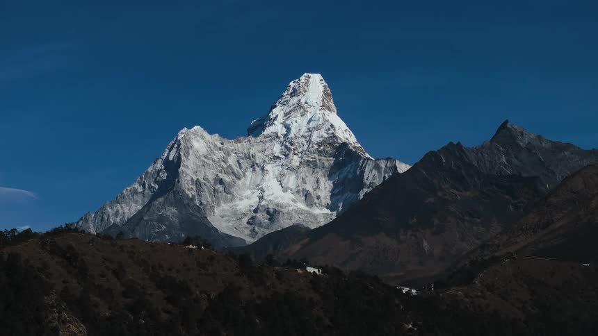 A mountain range with the highest peak covered in snow
