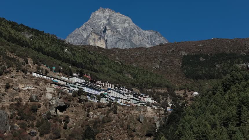 Village on a plateau in the mountains on a cloudless blue sky day