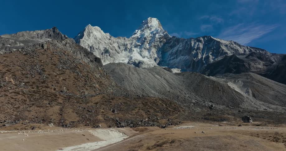 A valley next to a mountain range