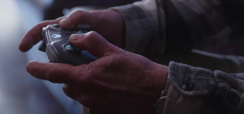 A person furiously pressing a video game controller