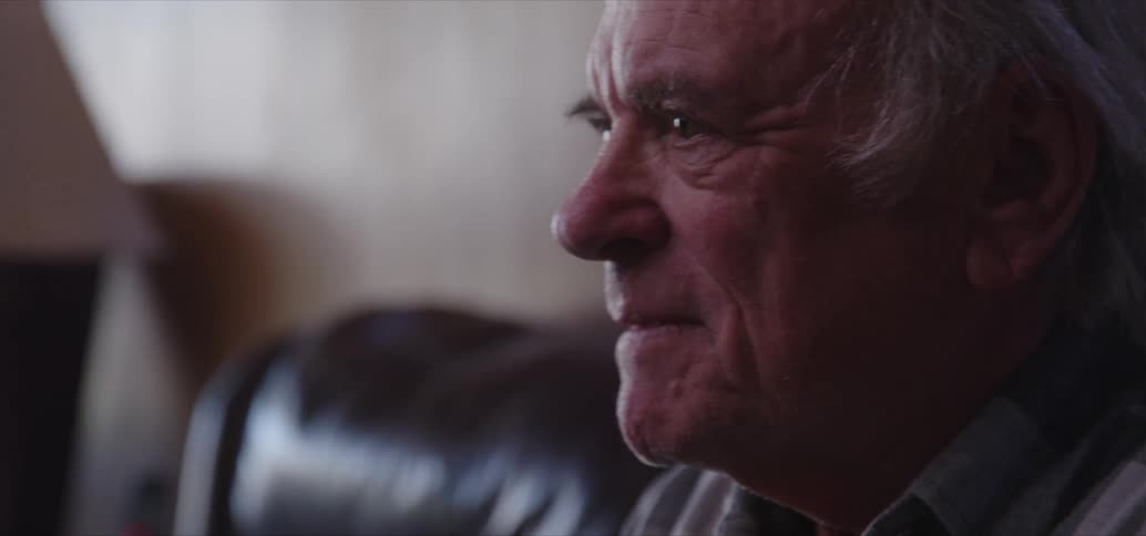 An old man bursts out laughing