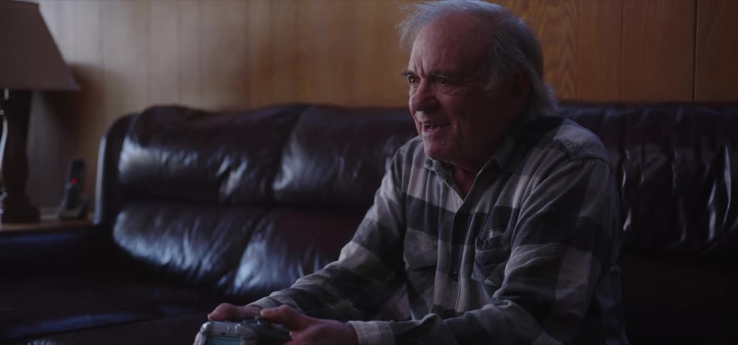 A man is playing video games with a controller