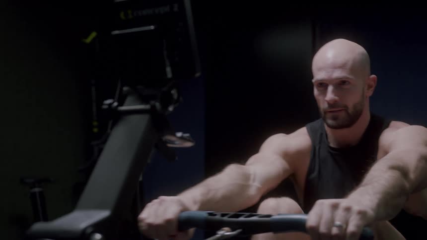 Man performing cardio on a pull bike with the lever