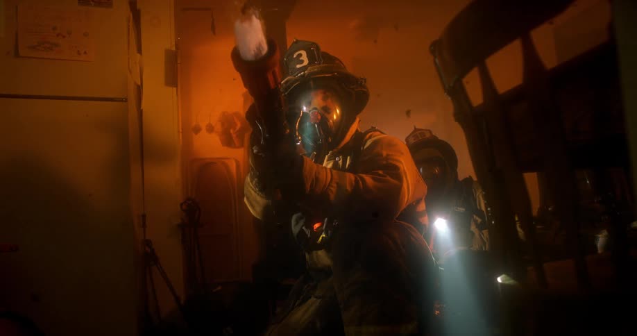 A firefighter shoots the hose