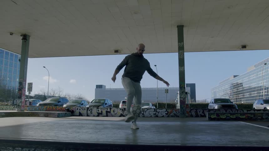 Man performing freestyle with a soccer ball